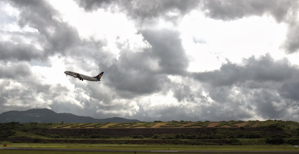 A Skymark jet taking off from Nagasaki Airport. by Christopher Hood