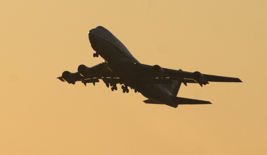 An ANA Boeing 747 taking off from Haneda Airport. by Christopher Hood