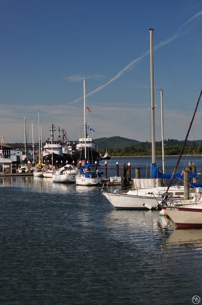 Boats along the Coos Bay waterfront. by Mike Goff