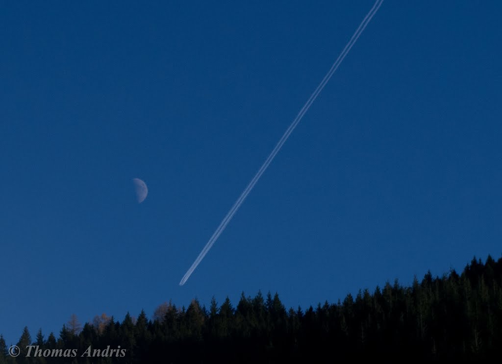 Moon and airplane by Thomas Andris