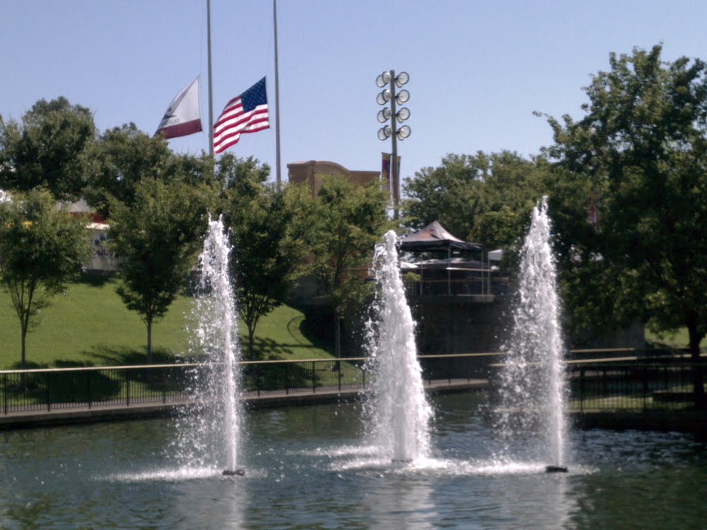 Flags at half mast at the California State Fair Remembering the Colorado shooting victims on July 20, 2012, a gunman attacked a movie theater in Aurora, Colorado.jpg by Ronald S. Hill