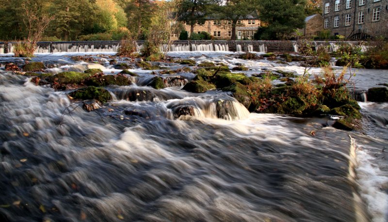 Bamford Mill under wooden bridge by Keith Rockley