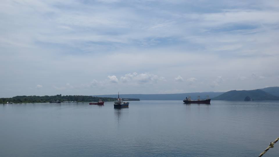 RABAUL, Ships anchored in Simpson Harbour, with Matupit Island on left & Vulcan Volcano Crater on right from Wharf area in Rabaul in ENBP in PNG, Photo by Esau Mellie on 4-01-2014 by Peter John Tate,