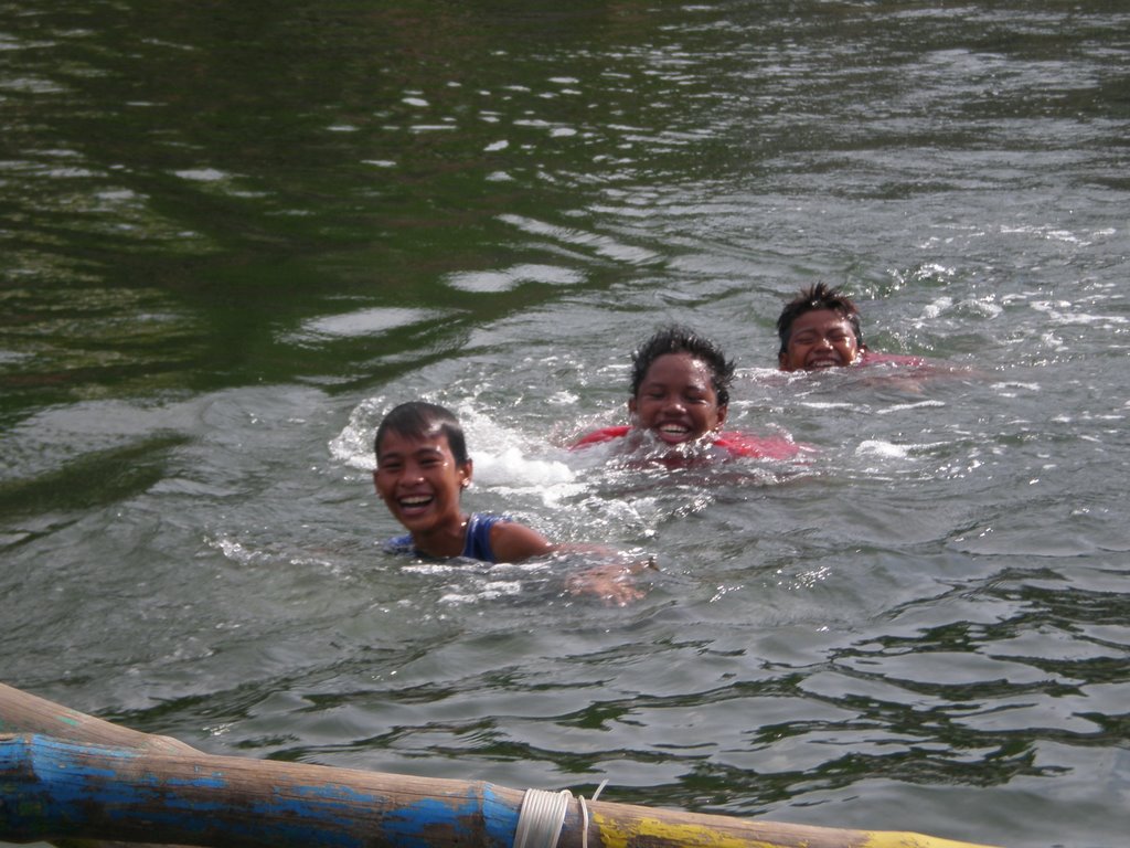 Kids catching a ride at Bolinao port by Michael Fast