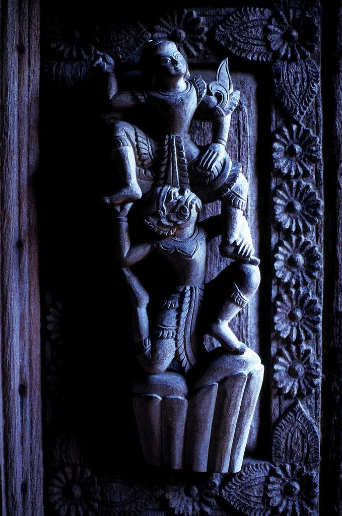 Sculpture on the door of a wooden Shwenandaw Monastery in Mandalay, Burma. by Marcin Klocek (trave…