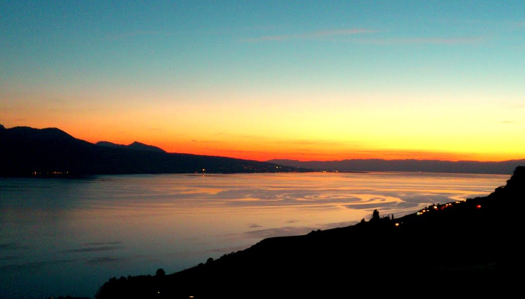 Eddies on the surface of Lake Geneva at sunset by rod bally