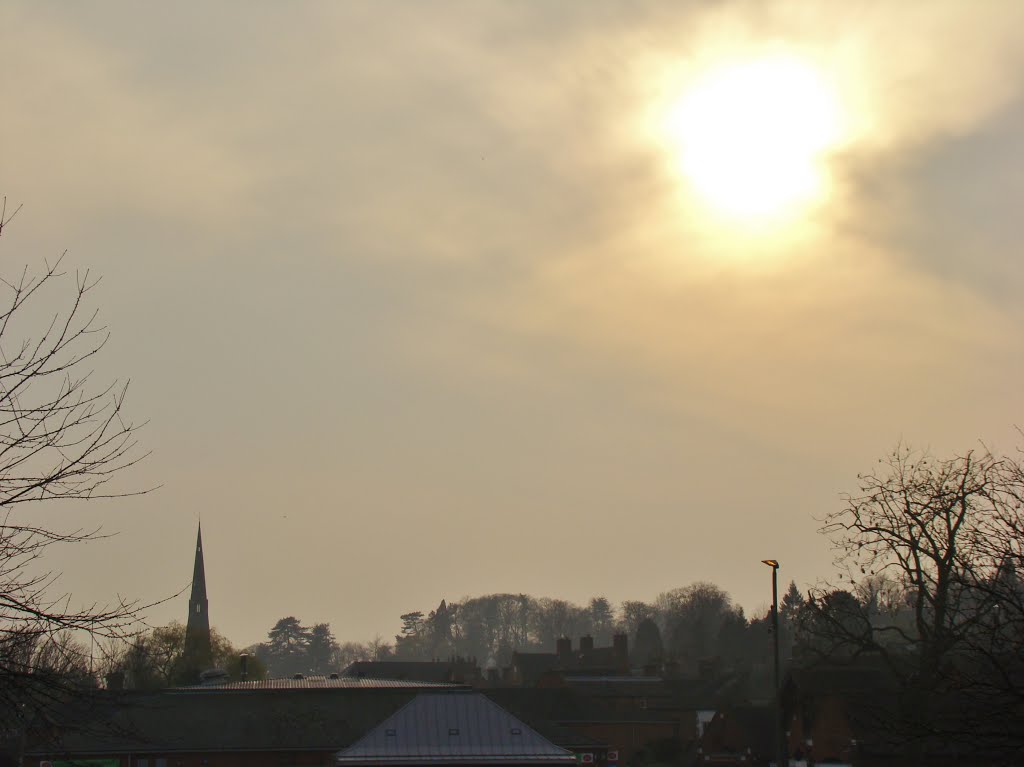 Setting sun through clouds over Ashbourne DE6 by six45ive