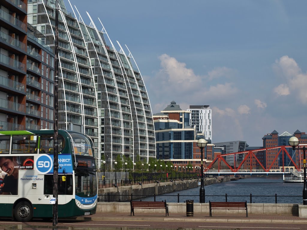 At the left the three NV Buildings on the Salford Quays at the Huron Basin, designed by Broadway Maylan Architects, and the City Lofts, designed by Conrad & Partners. The bridge is The Detroit Foodbridge, a former railway bridge. by Hans R van der Woude