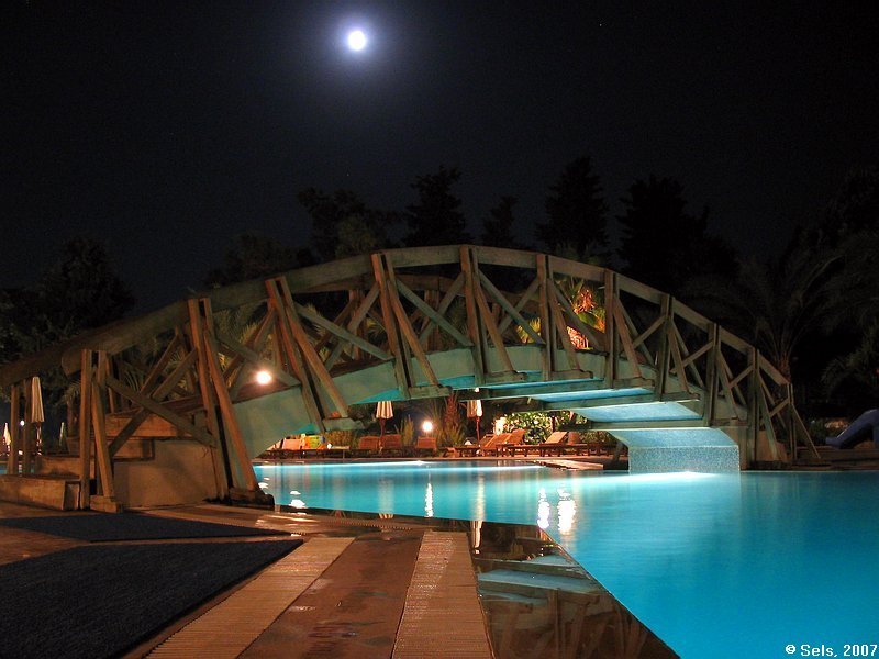 Swimming pool in Alara park hotel at night by Sels