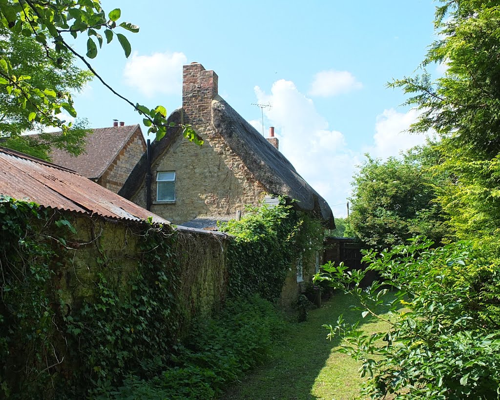 Towcester, corner cottage , seen from the South East part of the Church gardens. by Bobsky.