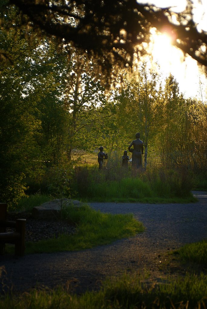 Fish Creek Park at sunset - "Egg Money" Bronze Statue by Jacenty