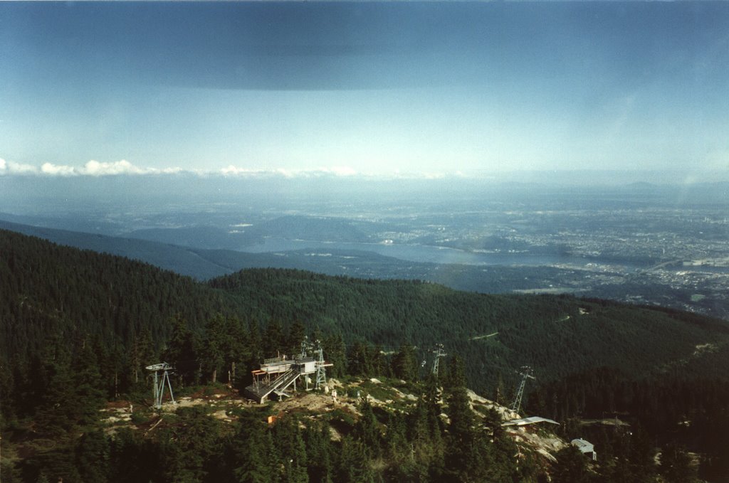 Grouse Mountain peak from helicopter by Boris Gjenero