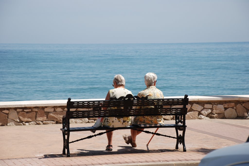 Mystery people on seat Fuengirola by Glyn M Evans