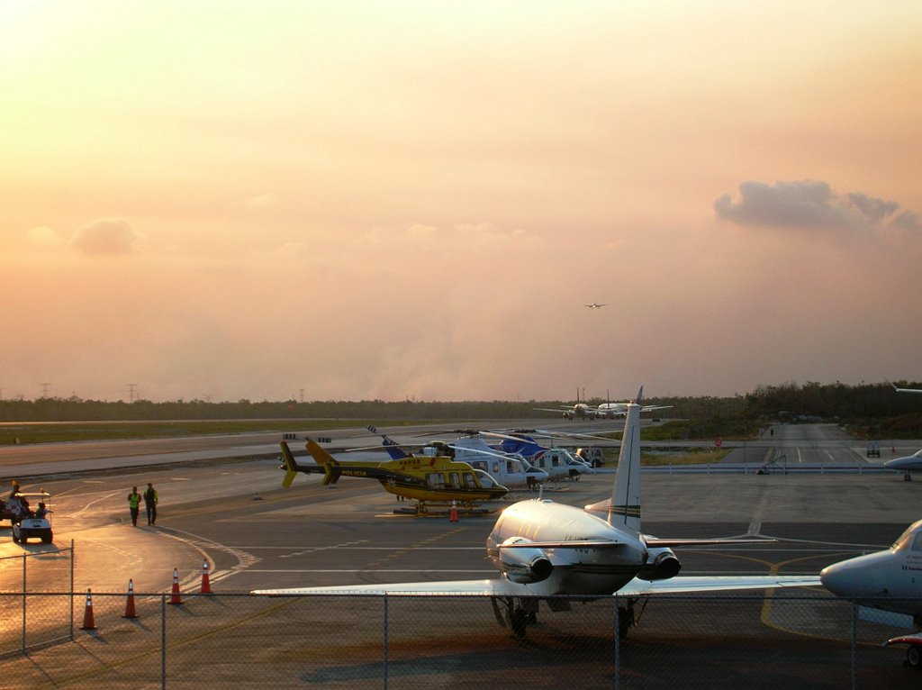 Cancun airport surrounded by smoke by Fabio Becchelli