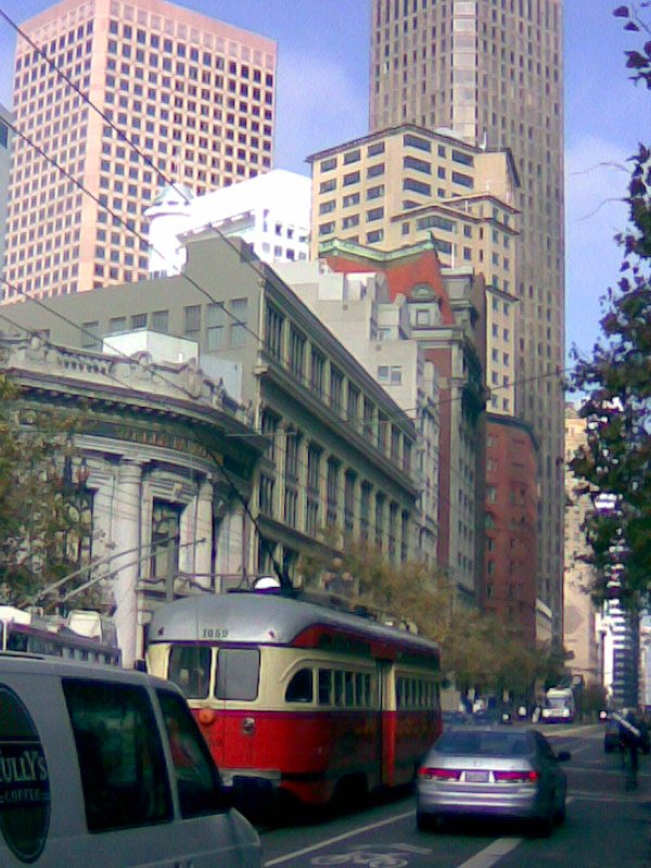 Downtown San Francisco and a red trolley by Stevan Gaskill