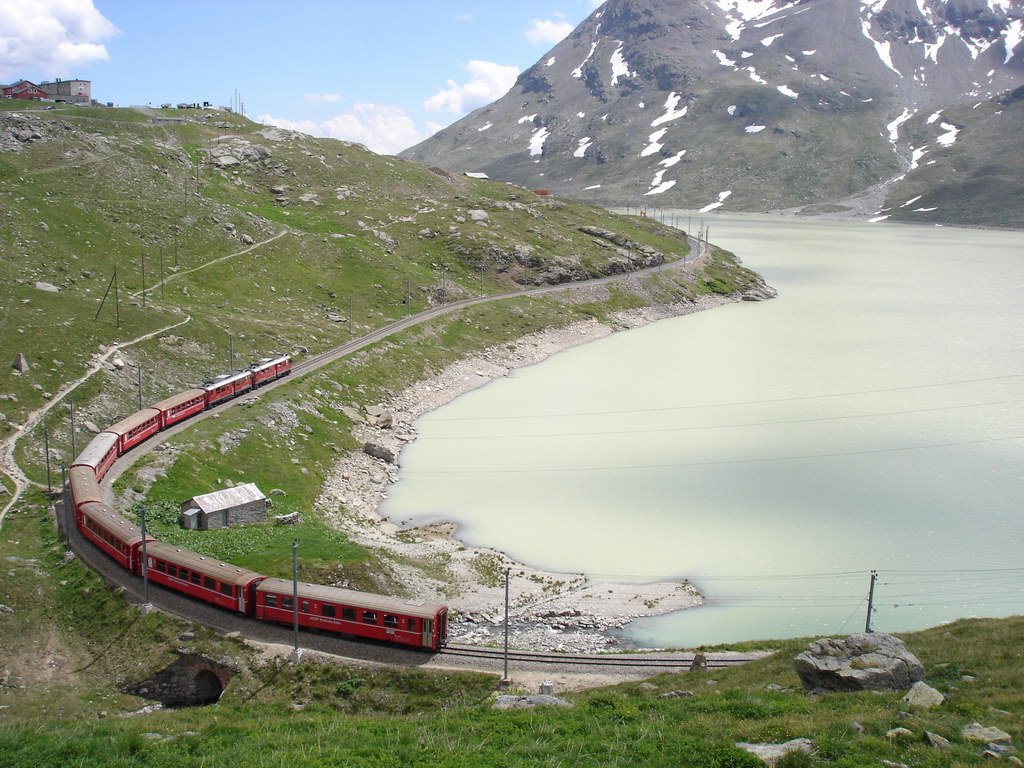 Passo Bernina - Lago Bianco e treno rosso by Andrea Corbo