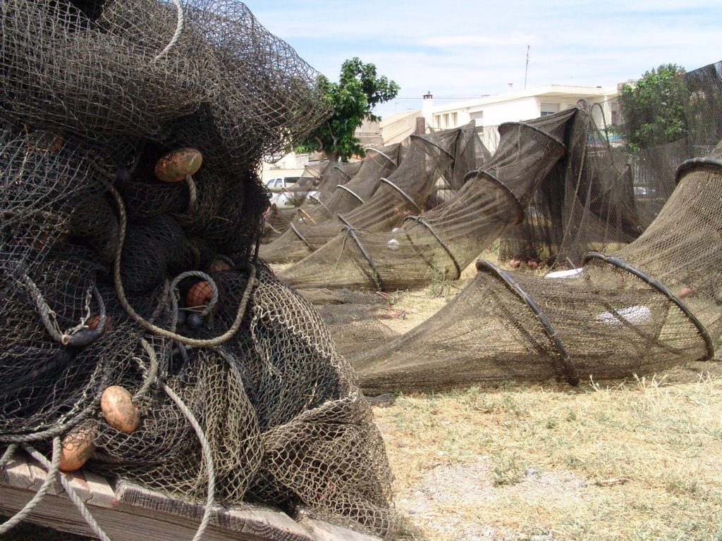 Fishing nets at the harbor in Meze by badhorsie65