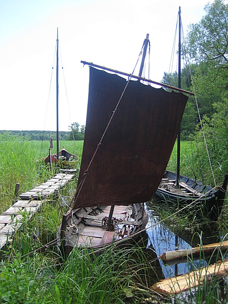 Longboats moored in the cove by the Viking village. by CarlStaffanHolmer