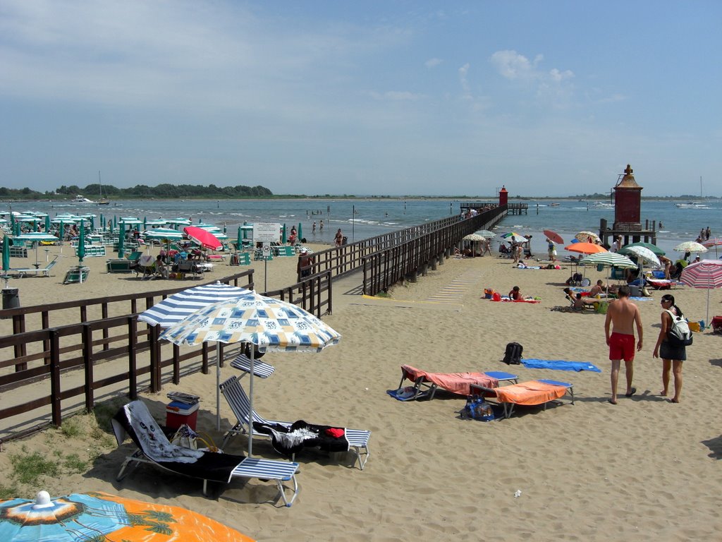 Gangplank and lighthouses at Lignano beach by makro