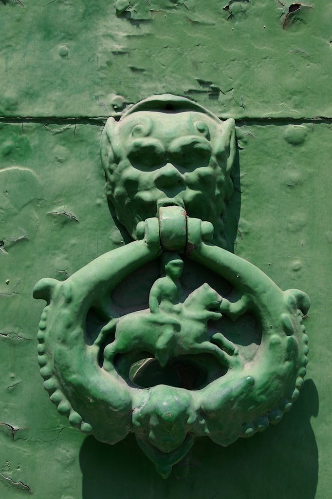 Door at the cathedral of Porto Maurizio, Imperia, Italy by Peter Behrens