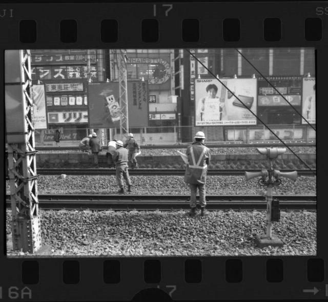 Tokyo Commuter Railway Workers by Mark Edward