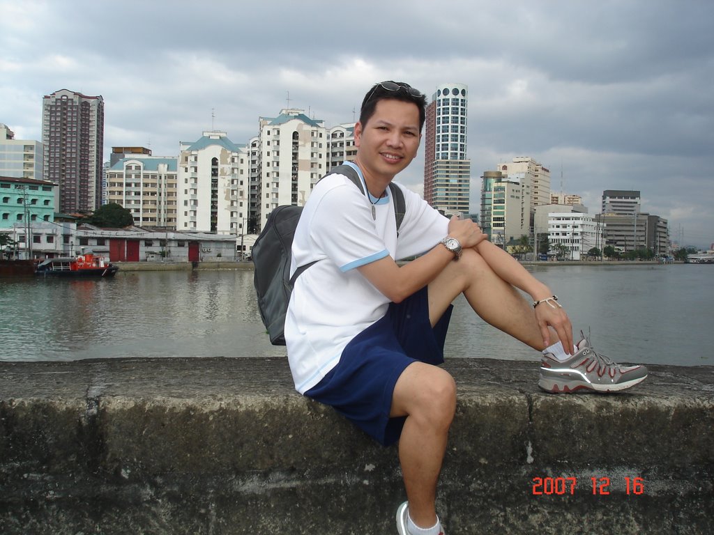 Intramuros wall and the Pasig River with Binondo Skyline by josewendell