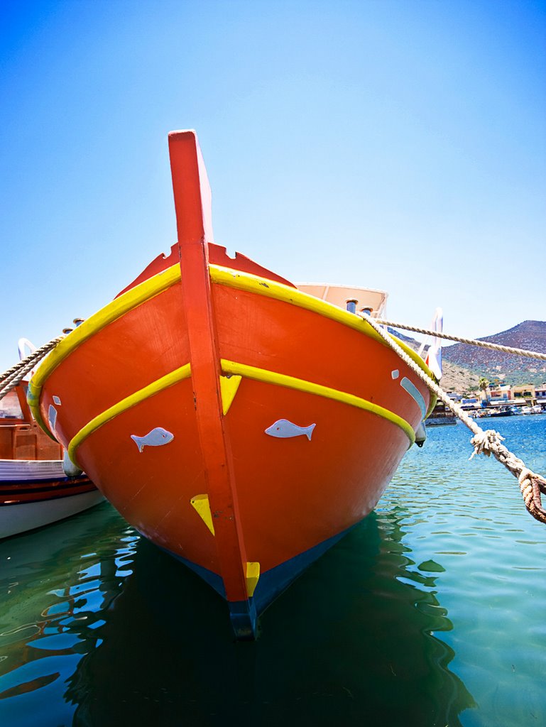 Red fishingboat in Elounda harbour, Crete, Greece by Wim Janssen