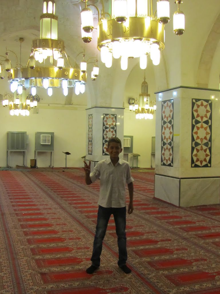 Palestinian Kid "hello", Ibrahim Mosque, Hebron by Jaim Uruna