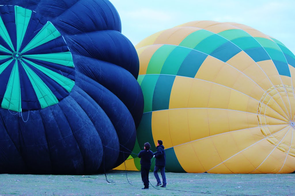 The early birds are inflating their hot air balloons first. Taken in Segovia, Spain. by Red Meadows