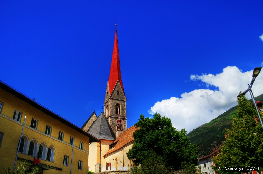 Die kath. Kirche Schlanders mit ihrem spitzen Kirchturm by Veitinger Germany