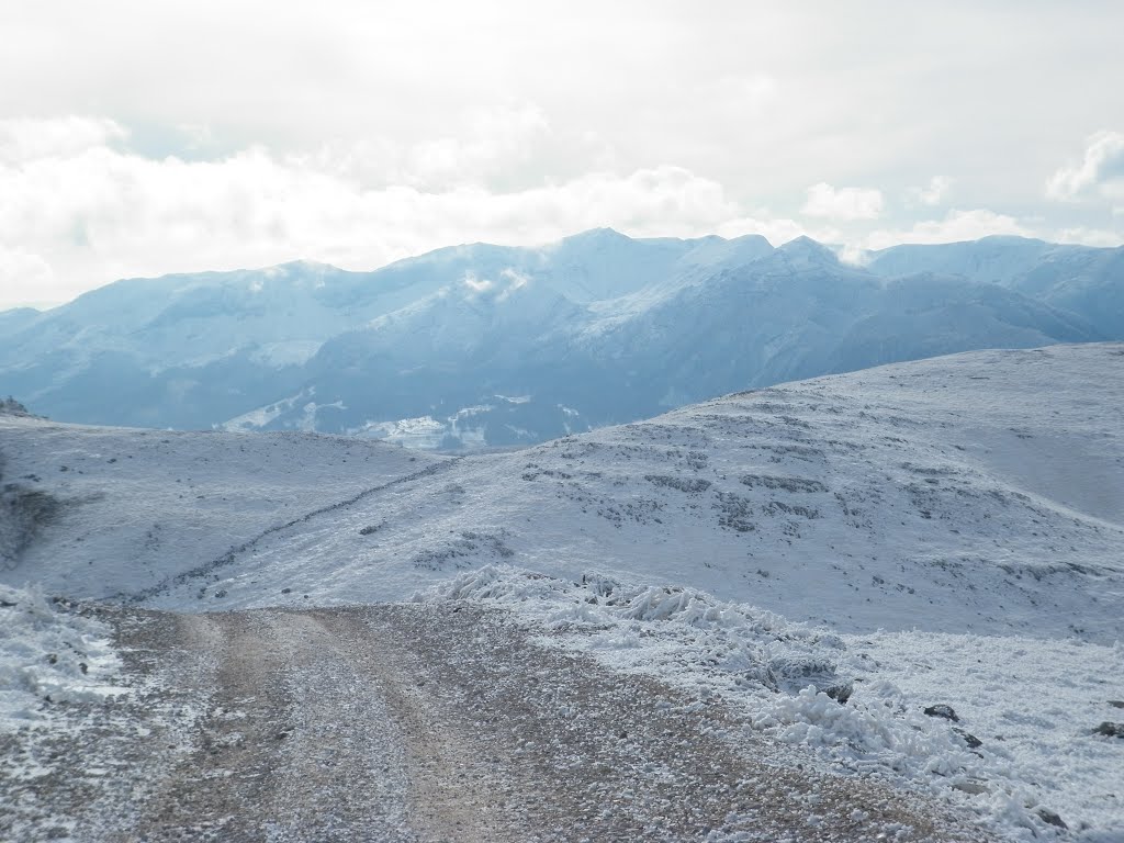 View of snow capped mountains from Bjelašnica, Trnovo, Bosnia & Herzegovina/Bosna i Hercegovina by Yiorgos Stathakis / …