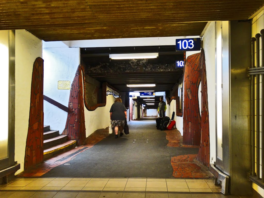 Uelsen trainstation in a Hundertwasser makeover, she does'nt care whatsoever by Jos Boom