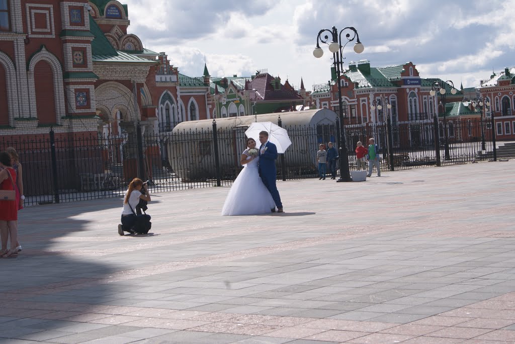 The wedding photo on Virgin Mary square in front of a cathedral of the Lady Day by john_smith14 (2)