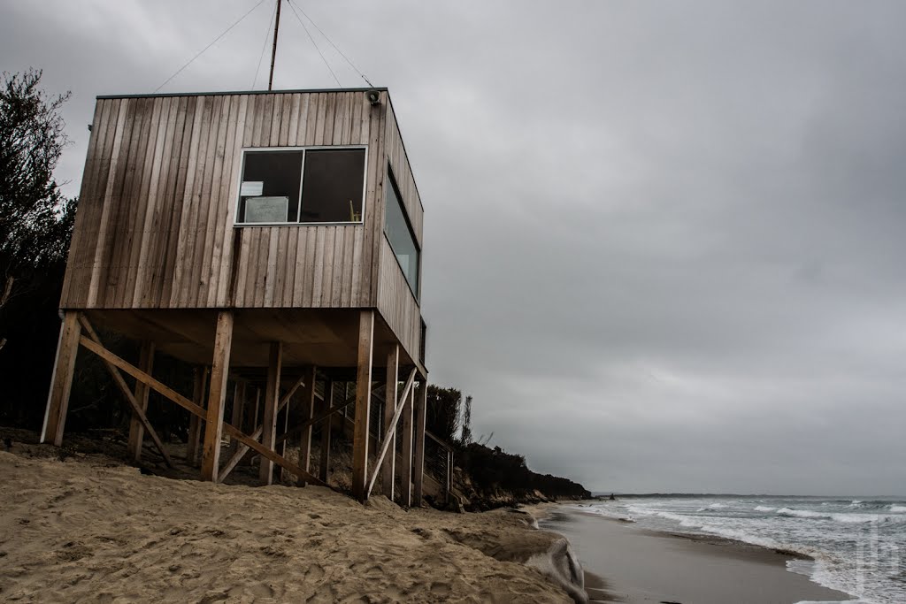 The Inverloch Surf Live Saving Tower on the surf beach protected from erosion by sandbags. ISO 400 | 1/500 sec | f/7 | 12mm #architecture   #architecturephotography   #beach   #seascape   #oceanphotography   #landscape   #landscapephotography   #australi by Joel Bramley