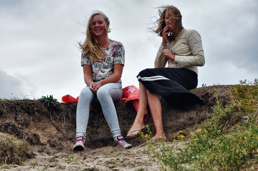 Girls in the wind at Katwijk aan Zee, Netherlands by Andre Speek