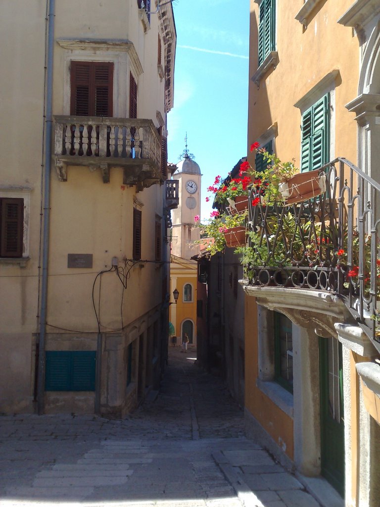 Labin, Narrow street with a church by Varga Tibor