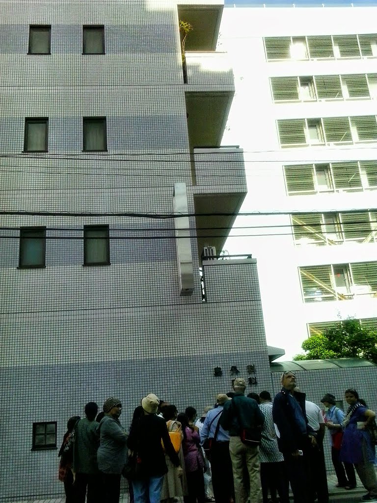 .Shims Hospital Building . Tourist looking at A-bomb Disaster Marker . by PM Velankar