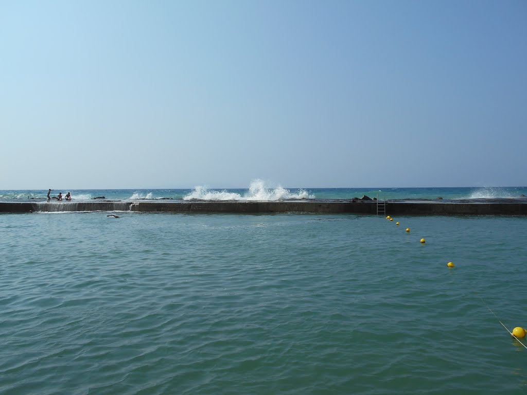 Breakwater outside Stella Palace hotel by Professor Mungleton