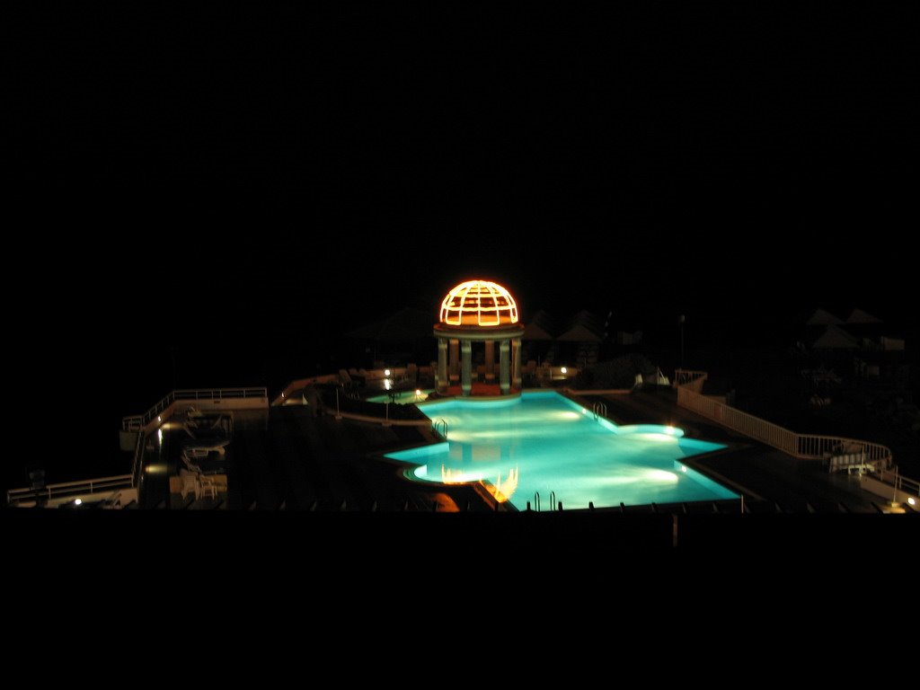 Night view of the pool from our room at the Dome Hotel by wybell