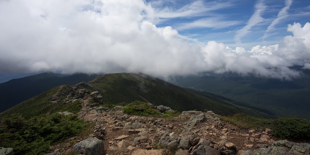 Ridge trail with the road in the background by Sawyer Sutton