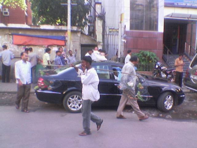 Bird seller is walking infront of a Maecidies(by Apurba)june 2008 by Apurba