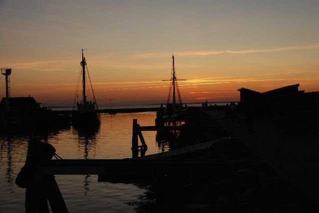 Sunset at the harbour by Christopher Leth