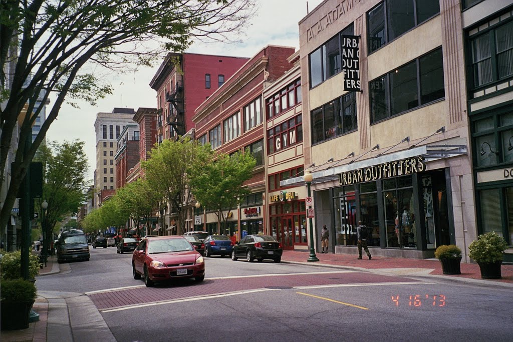 Not in the Mall: Urban Outfitters chooses to open on Granby downtown Norfolk's historic shopping street, NOT in the Macarthur Center which unfortunately dominates downtown retail. The tall building (with outside fire escape) is the Tazewell Hotel where yo by miklospogonyi