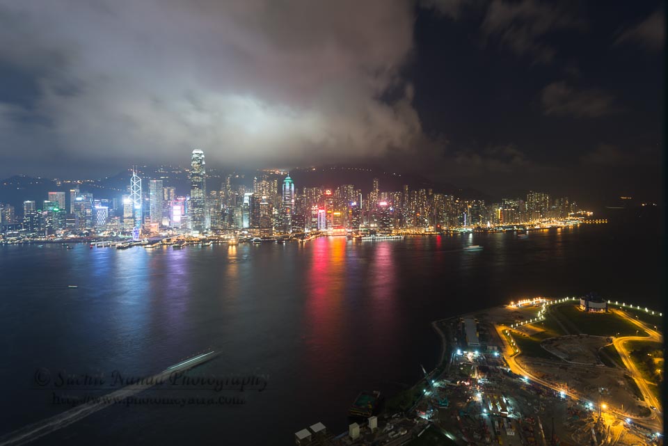 Panoramic Hong Kong night Skyline as seen from Kowloon. by Suchit Nanda