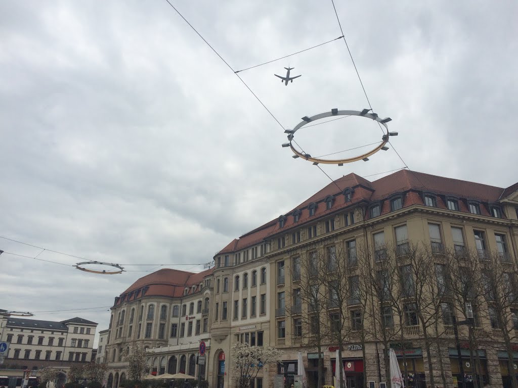 A plane is passing from Erfurt main train station by Rahat Noman