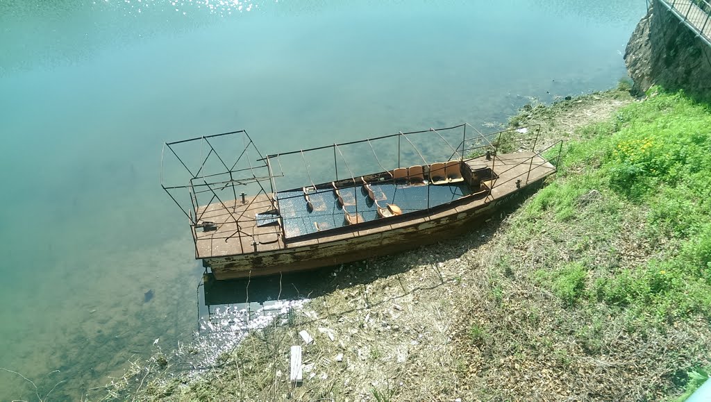 Abandoned boat on China side of Great Wall of China by Walter Wu