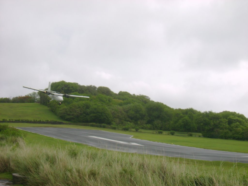 Grenadine Airways landing at Mustique airport. by Yusef leslie