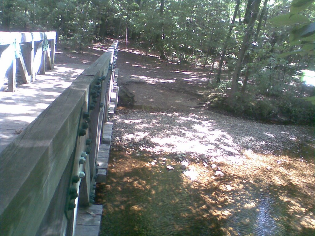 Mill river. Light and shade on the water flowing. by George in USA