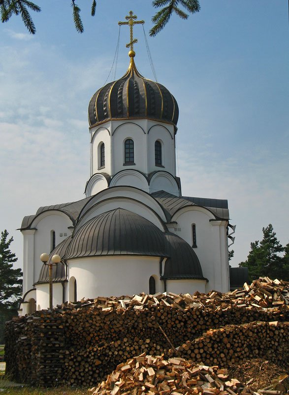 Firewood behind the Church of the Birth of Christ in Vialikaje Ściklieva village by Andrej Kuźniečyk