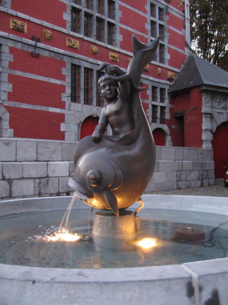 Street scene, boy and fish fountain, Liege, Belgium, a snake or eel in hand? by Marshall X Ma